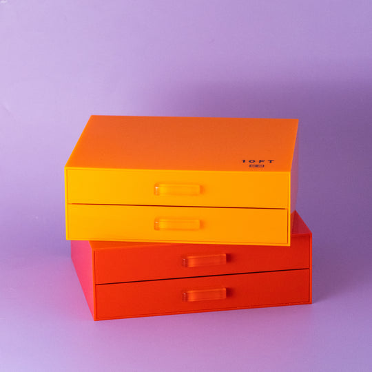 A STACK OF MAKEUP ORGANIZERS